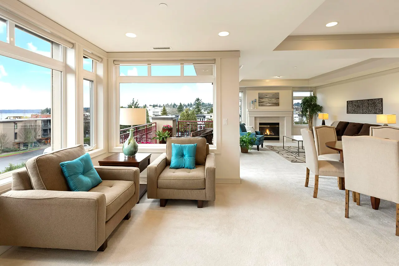 Blurred abstract background interior view looking out toward to empty office lobby and entrance doors and glass curtain wall with frame - blue white balance processing style